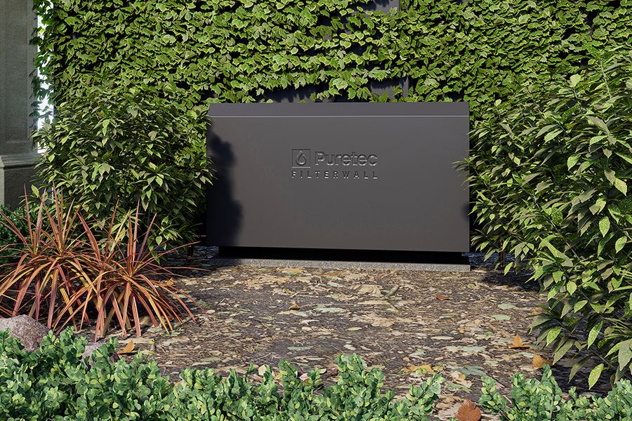 FilterWall F3 in Charcoal against a hedge