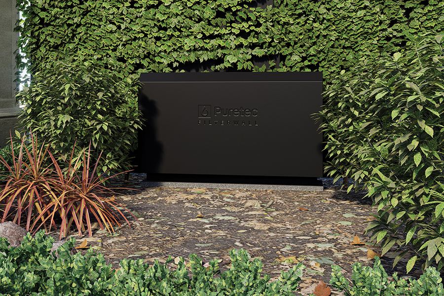 FilterWall F3 in Midnight Black against a hedge