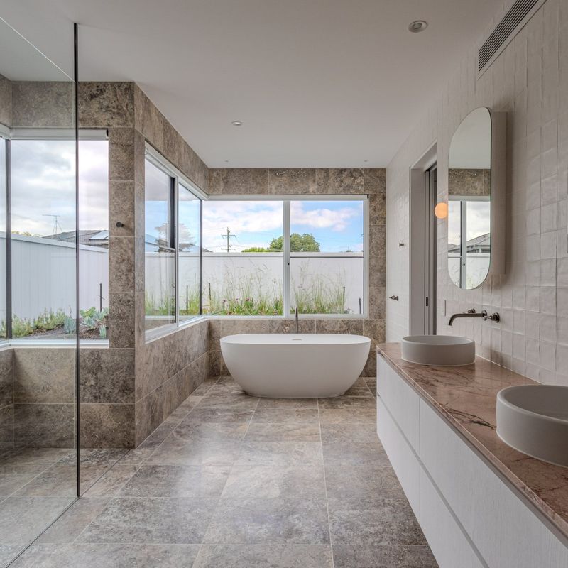 Bathroom with freestanding bath and double basins in an Ashburton home plumbed by Scotland Marshall Plumbing