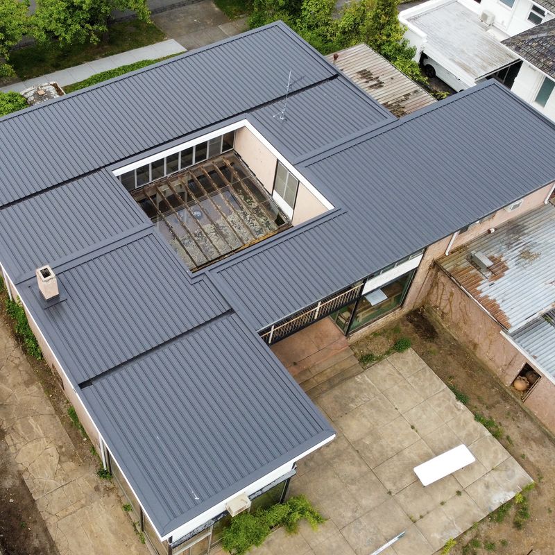 New Colorbond roof by Scotland Marshall Plumbing on a Toorak home, aerial view