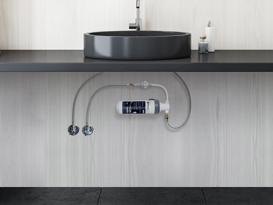 Puretec PureMix Z2 fitted under a sink, connected to the existing mixer tap