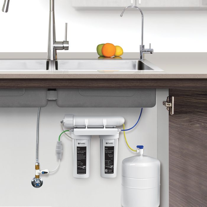Puretec reverse osmosis system under a kitchen sink with its own drinking tap
